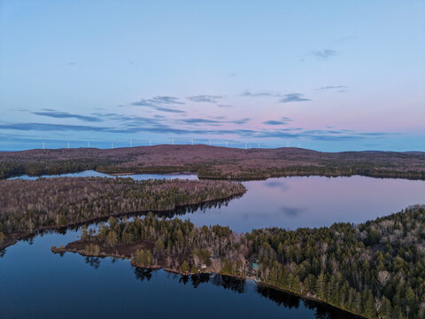 Aerial View of Caribou Pond Lincoln Maine a Sunset With Wind Turbines on Distant Hills and Calm Reflections