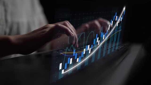 A person types on a laptop keyboard, with dynamic stock market graphs and financial data projected visually, capturing the essence of modern financial analysis and technology. Copula