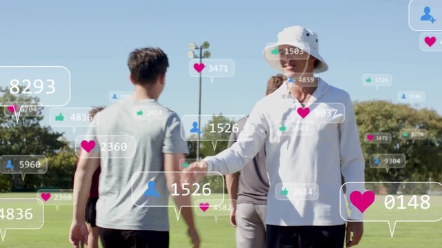 Players crossing sports pitch, white-shirted man greeting, shaking hands with social icons showing