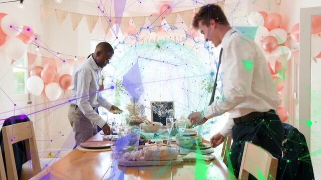 Three adults approaching table, pulling chairs and arranging plates, glasses and platters for event