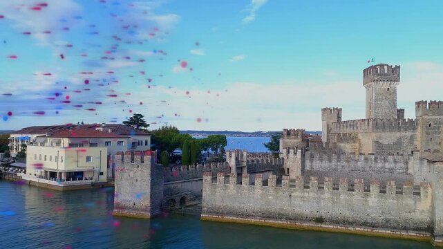 Particles emerging left, sweeping over water while camera panning right, revealing fortress walls