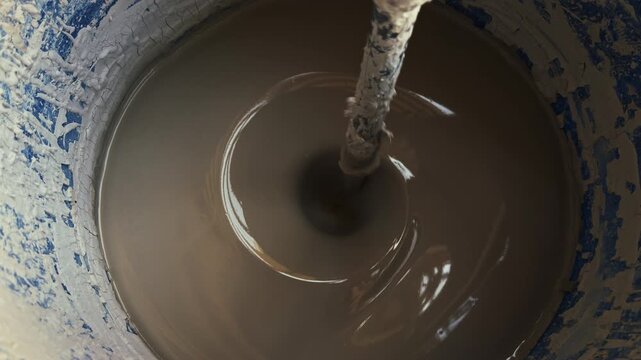 Clay Mud Swirling in an Industrial Ceramic Studio Mixer