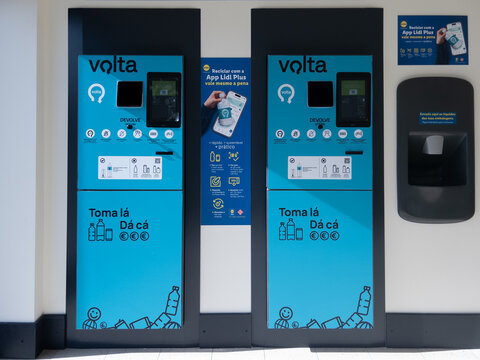 Electronic recycling machine for bottles and cans in Portugal. Official government recycling program called Volta that refunds money for returned cans and bottles. Machines placed inside supermarkets.