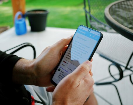 Middle Aged Man Encounters Cybersecurity Issue With Oversharing Social Media Platform - Invasive Memes Asking Personal Information Harvesting Concept