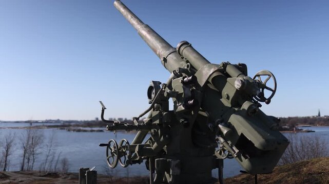 Close up artillery cannon barrel metal texture military equipment historic weapon detail war concept dark dramatic scene