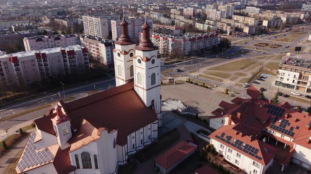 Drone Rooftop View Bell Tower Texture And Spire Details, Clay Tiles, Masonry Joints, Adjacent Roofs And Parking, Urban Backdrop, Crisp Light Ideal For Restoration, Architecture And Closeup
