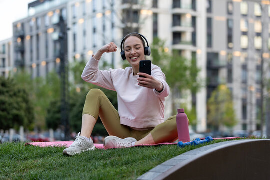 Woman celebrating fitness progress connecting online