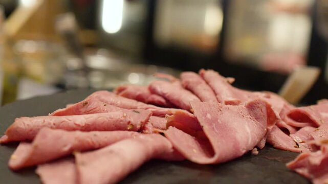 Thinly Sliced Roast Beef Cold Cuts on a Buffet Platter