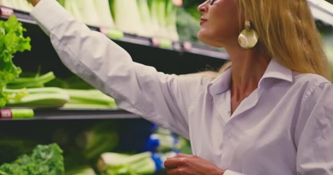Woman Selecting Fresh Produce in Supermarket