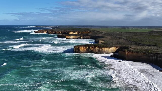 Great Ocean Road, Peterborough, Victoria, Australia: 4K aerial drone footage of London Arch (Bridge), Port Campbell National Park, limestone cliffs, ocean waves, rock formations, rugged coastline