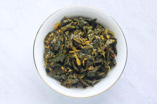Top view of a bowl of Garo Bunga Pepaya, a signature vegetable dish from Manado, North Sulawesi.