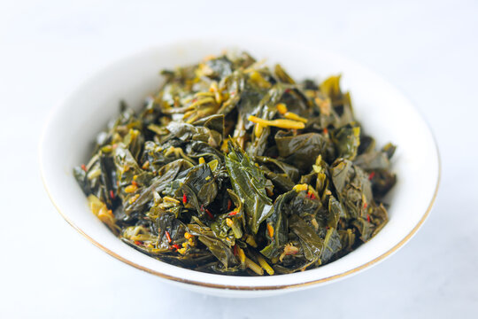 A bowl of Garo Bunga Pepaya, a signature vegetable dish from Manado, North Sulawesi.