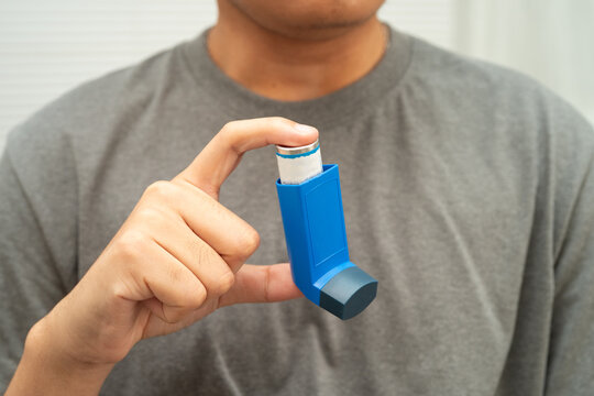 Asthma and chronic obstructive pulmonary disease COPD, Asian teenage using metered dose inhaler MDI.