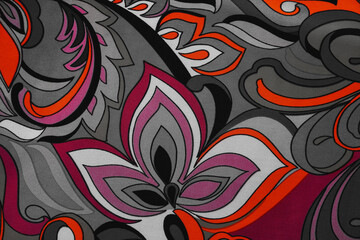 Colorful abstract floral pattern fabric texture with retro paisley motif in pink orange and gray tones © electra kay-smith