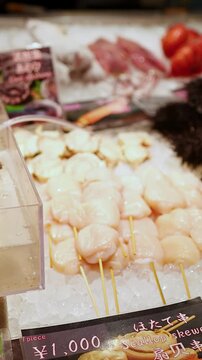 Fresh Seafood Display with Live Prawns and Scallops at Kuromon Market