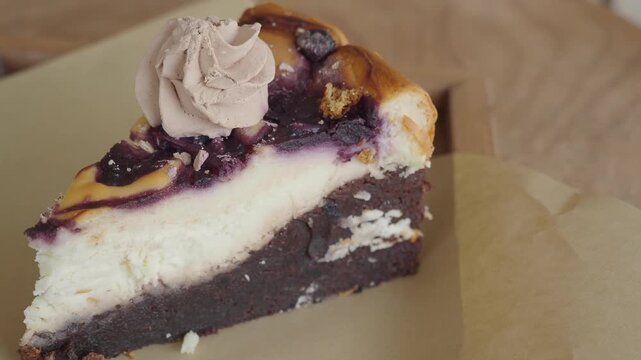 People are enjoying cheesecake topped with creamy frosting at the cafe