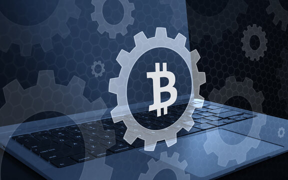 Bitcoin digital currency concept with gear mechanism on laptop computer keyboard, representing blockchain technology settings, financial system operations and crypto security