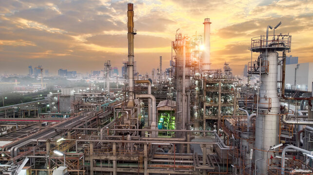 Oil and gas industry - refinery factory zone, The equipment of oil refining,Close-up of industrial pipelines of an oil-refinery petrochemical plant at sunset
