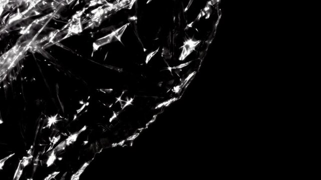 Crinkled Plastic Wrap Texture Moving on Black Background