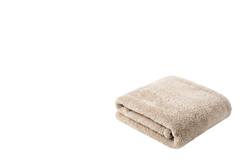 Folded fluffy beige fleece blanket isolated © PEE PHIBAN