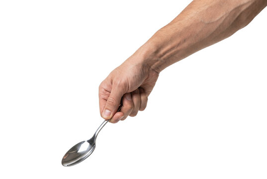 Male hand holding silver spoon downwards