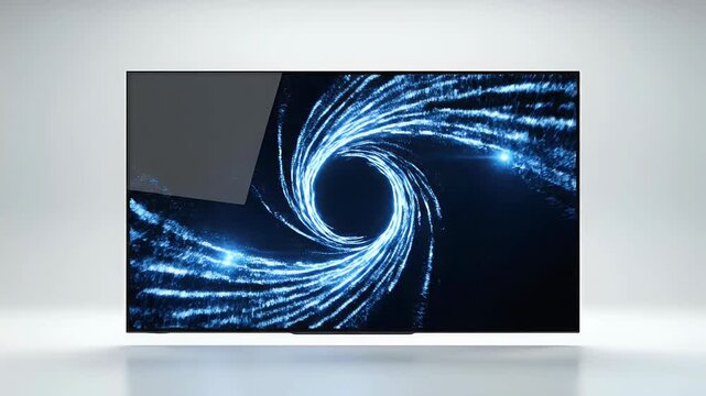 A modern flat-screen television displays a striking abstract blue light pattern against a dark background, showcasing advanced display technology.