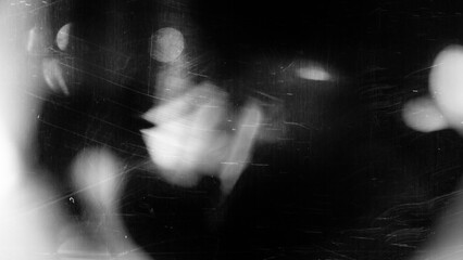 retro film overlay effect with scratch dust and bokeh light leaks, retro grain noisy film distressed light leak flare on black background, black and white abstract background, Abstract old film