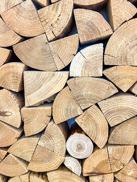 Wood wall background and texture log texture background wall. Beautifully arranged log texture wallpaper. Construction wood wall art background for design projects.