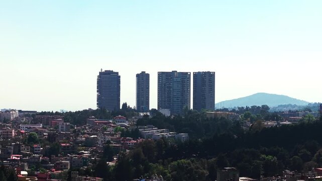 Modern skyscrapers and residential towers rising above a dense urban neighborhood, 4K D-Log