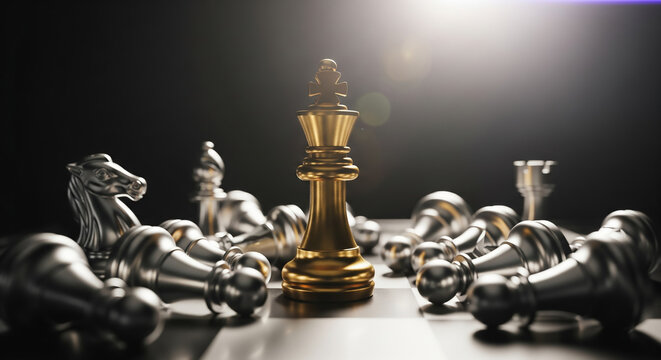 Golden king chess piece standing among fallen silver pieces on a board with dramatic lighting