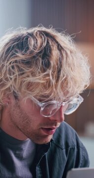 Thinking, planning and man with laptop in agency, inspiration and branding idea for digital campaign. Reflection, creativity and marketing manager with pc for research, ads proposal and perspective