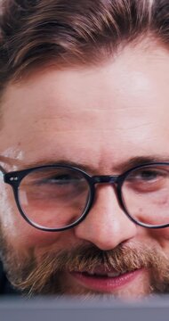 Smile, business and man with laptop in office for research, finance report and investigation. Happy, broker and glasses with pc for financial assessment, risk management and compliance information