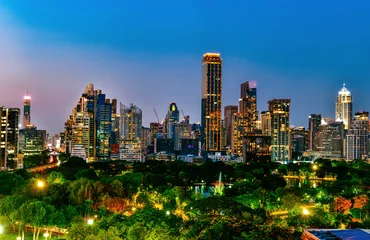 Bangkok city skyline at night with Lumphini Park green space from Dusit Central Park viewpoint, Thailand. © I Viewfinder