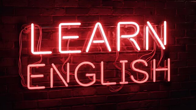A vibrant, fiery neon sign boldly proclaims 'Learn English' against a textured brick wall, creating a striking and motivational visual.