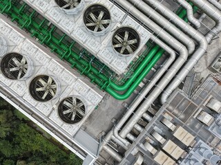 Top down view of industrial cooling towers and pipes. © eric1207cvb