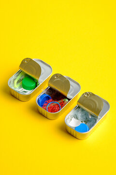 Microplastic contamination concept in canned food on yellow