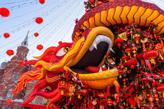 Chinese New Year dragon decoration with lanterns outdoors