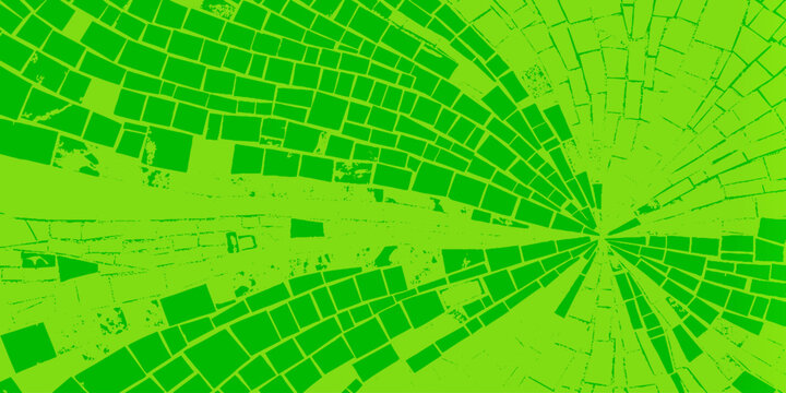 Vibrant green shattered glass effect with radial broken tile pattern background texture as abstract green background