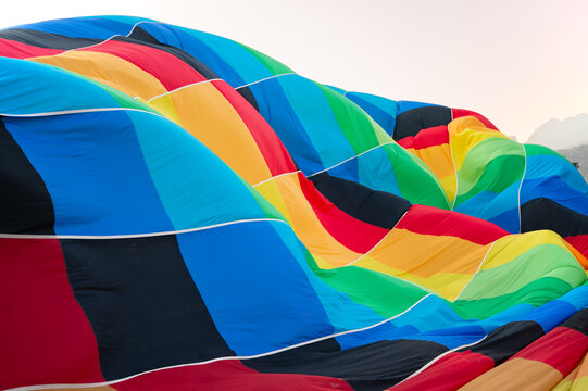Colorful hot air balloon fabric preparing for flight