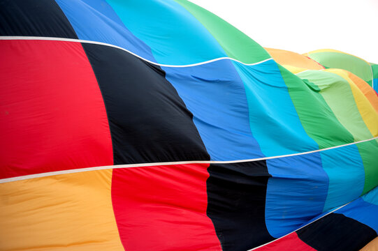 Colorful hot air balloon fabric close up before flight