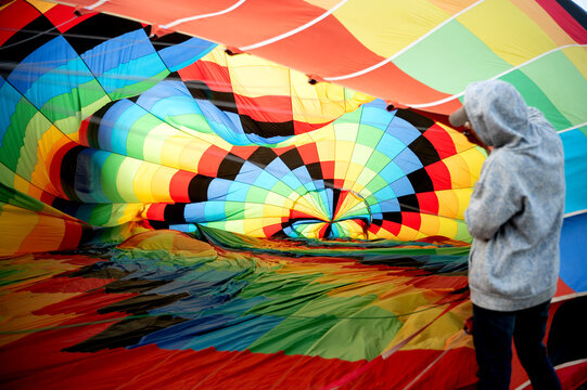 Colorful hot air balloon being prepared before flight