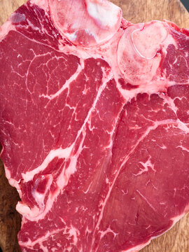 Fresh t-bone steak ready for grilling or cooking at home