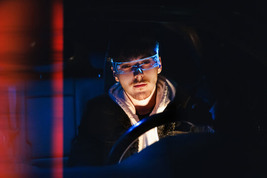 Man wearing holographic visor in cyber night lighting scene