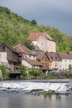 Long exposure river waterfall in Lods village, France