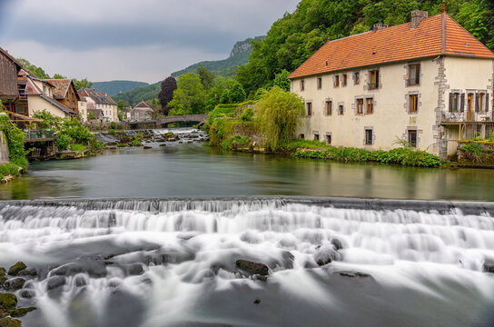 Long exposure river and waterfall in Lods, France village