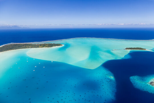Aerial view of Bora Bora lagoon with turquoise shallows