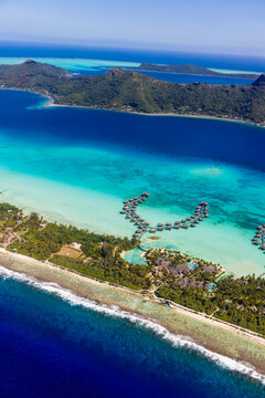 Aerial view of Bora Bora lagoon with overwater bungalows