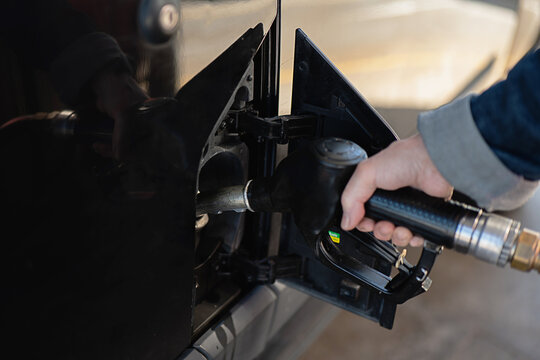 Refueling a vehicle at the gas station pump