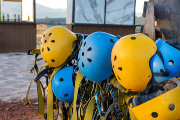 Assorted Colorful Safety Helmets and Harness Equipment Ready for Outdoor Adventure Activity © sandor