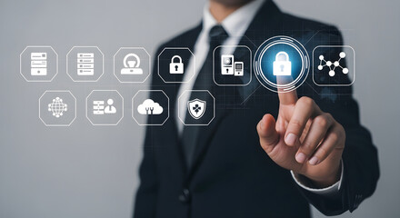 Fototapeta premium Man in suit interacts with futuristic interface icons on finger tip.